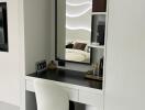 Vanity area with a mirror and chair in modern bedroom