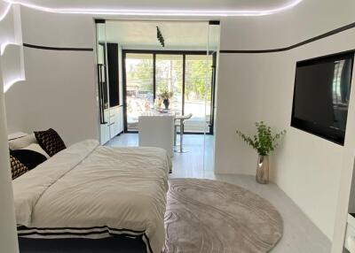Modern bedroom with minimalist design, floating bed, and natural light