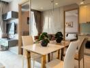 Modern dining area adjacent to a living room and bedroom with contemporary furnishings