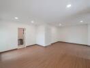 Spacious living room with wooden flooring