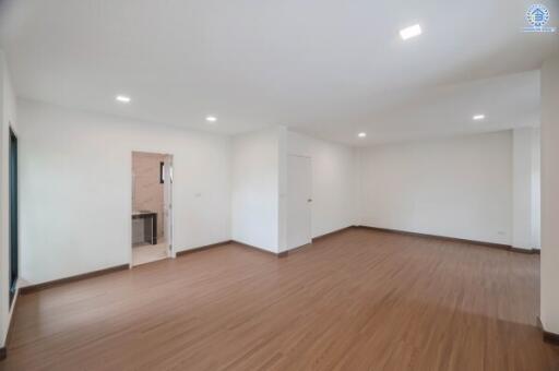 Spacious living room with wooden flooring