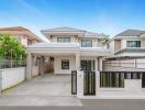 Modern two-story house with a gated front yard