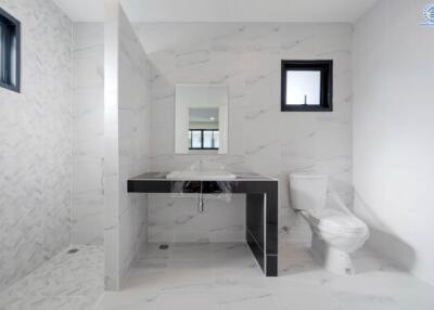 Bathroom with modern fixtures and marble tiles