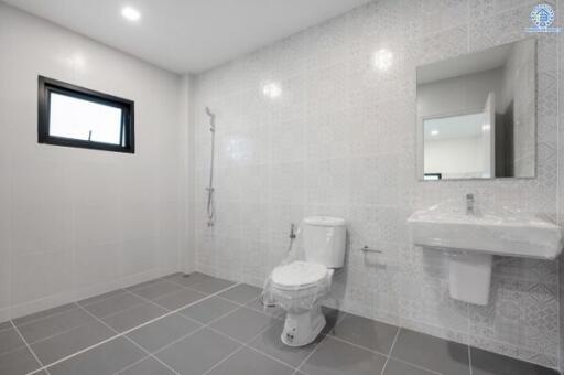 Modern bathroom with shower, toilet, and sink