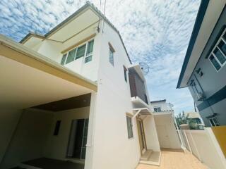 side view of a modern two-story house