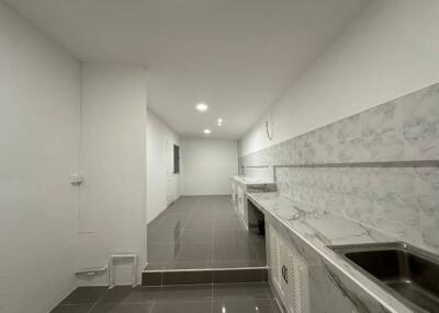 Modern kitchen with tiled backsplash and minimalist design