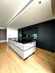 Modern kitchen with black cabinetry and island counter