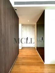 Modern hallway with wooden flooring and built-in storage