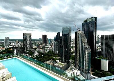 Large balcony with pool overlooking city skyline