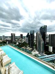 Large balcony with pool overlooking city skyline