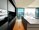 Modern kitchen with island and city view