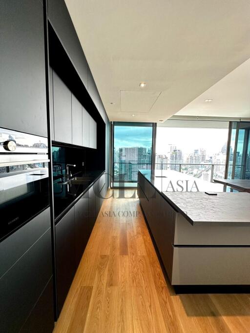 Modern kitchen with island and city view