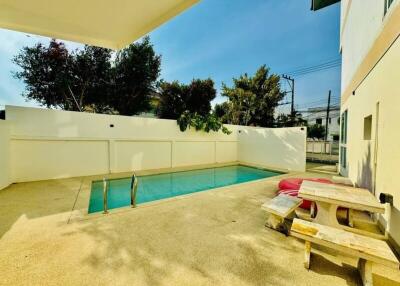 Outdoor area with swimming pool and picnic table