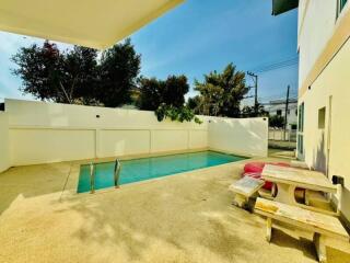 Outdoor area with swimming pool and picnic table