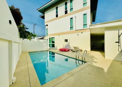 swimming pool area outside a building