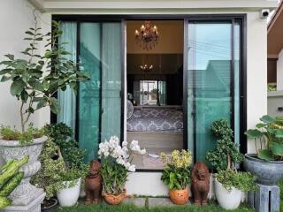 Elegant bedroom view with glass sliding doors and garden