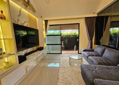 Modern living room with large sofa and entertainment center