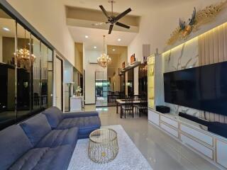 Spacious living room with high ceiling and modern decor