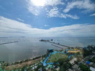 Aerial view of a coastal landscape with sea and recreational areas