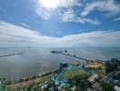 Aerial view of a coastal landscape with sea and recreational areas