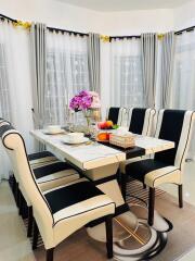 Elegant dining room with a set dining table and decorative elements