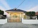 Front view of a single-story home with a decorative gate