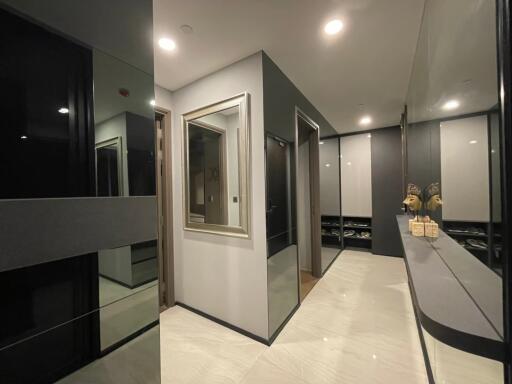 Modern hallway with mirrors and stylish lighting