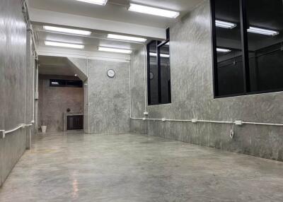 industrial-style open space with concrete walls and floor