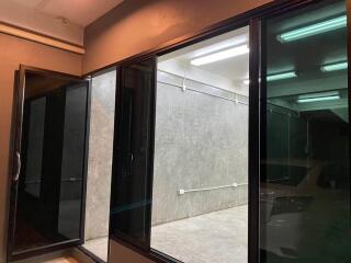Sliding glass doors with a view of an indoor parking area