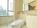 Bathroom with modern fixtures and a view of the city skyline