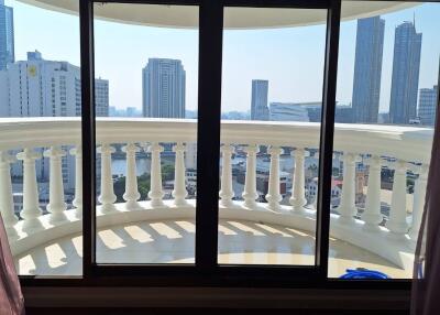 Balcony with city view and glass doors