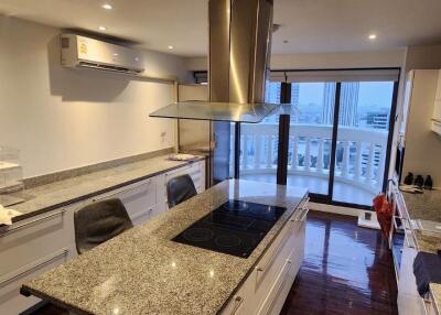 Modern kitchen with granite countertop and island