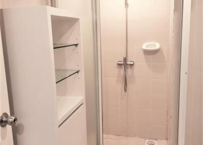 Bathroom with glass-door shower stall and modern fixtures