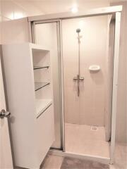 Bathroom with glass-door shower stall and modern fixtures