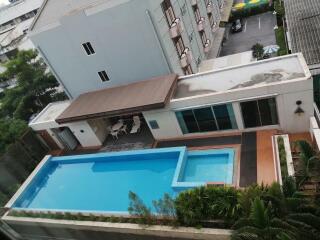 Outdoor swimming pool with seating area