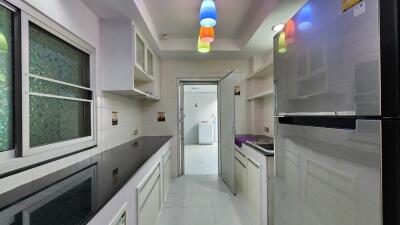 Modern kitchen with appliances and colorful lighting