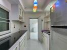 Modern kitchen with appliances and colorful lighting