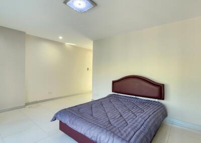 Spacious bedroom with modern lighting and air conditioning