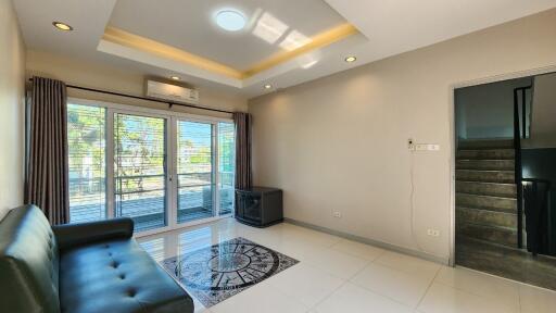 Bright and modern living room with large windows and balcony access