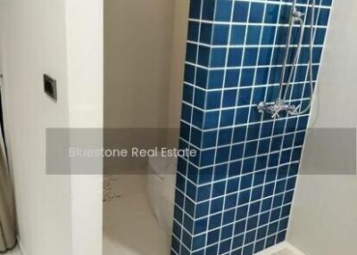 Bathroom with tiled shower area