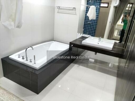 Modern bathroom with large bathtub and sink