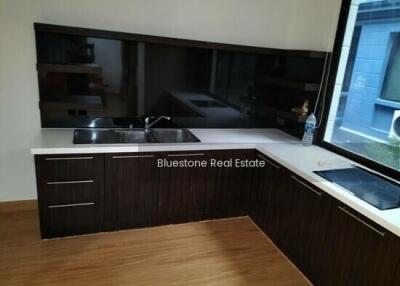 Modern compact kitchen with a black and white theme