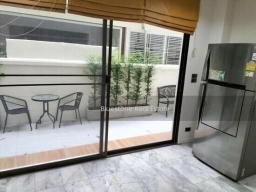 Kitchen with sliding doors leading to a outdoor patio area