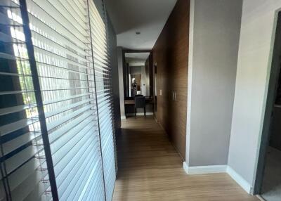 Modern hallway with wooden floor and blinds