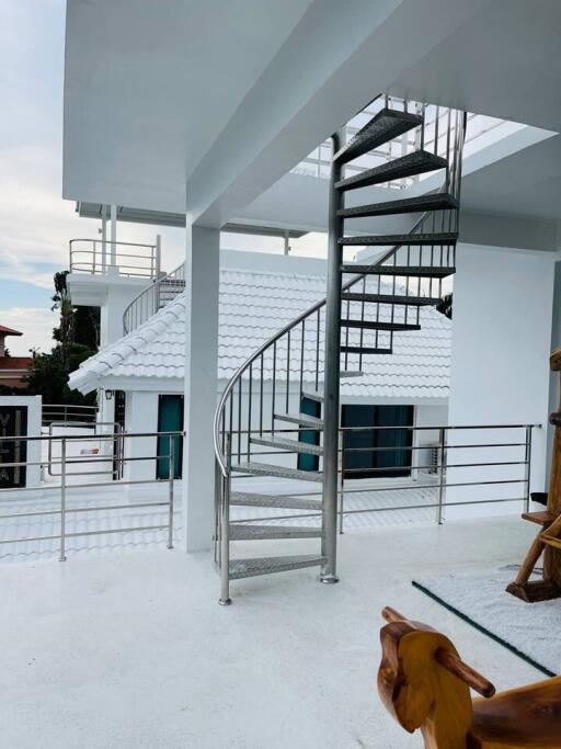 Outdoor view with modern spiral staircase