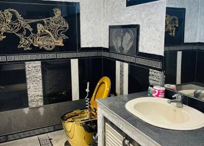 Decorative bathroom with gold accents