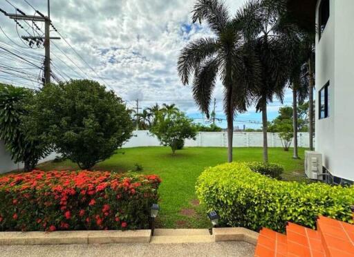 Beautiful garden area with lush greenery and palm trees