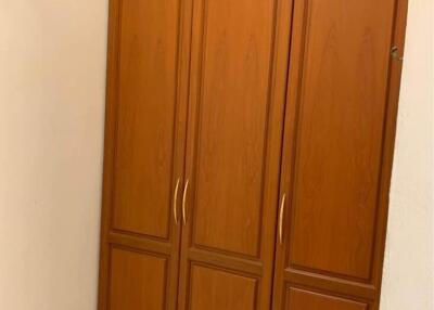 Large wooden wardrobe with ample storage