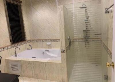 Modern bathroom with glass shower and bathtub
