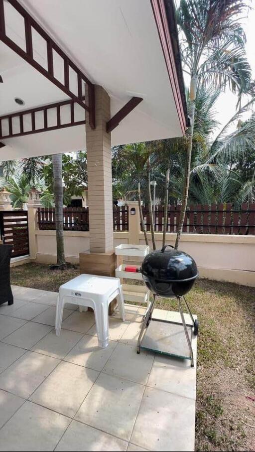 Outdoor patio with garden and barbecue grill